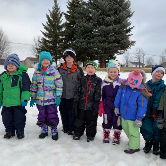 Kids in Winter Coats in Snow