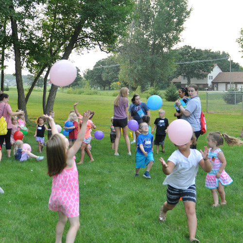 Kids playing with balloons