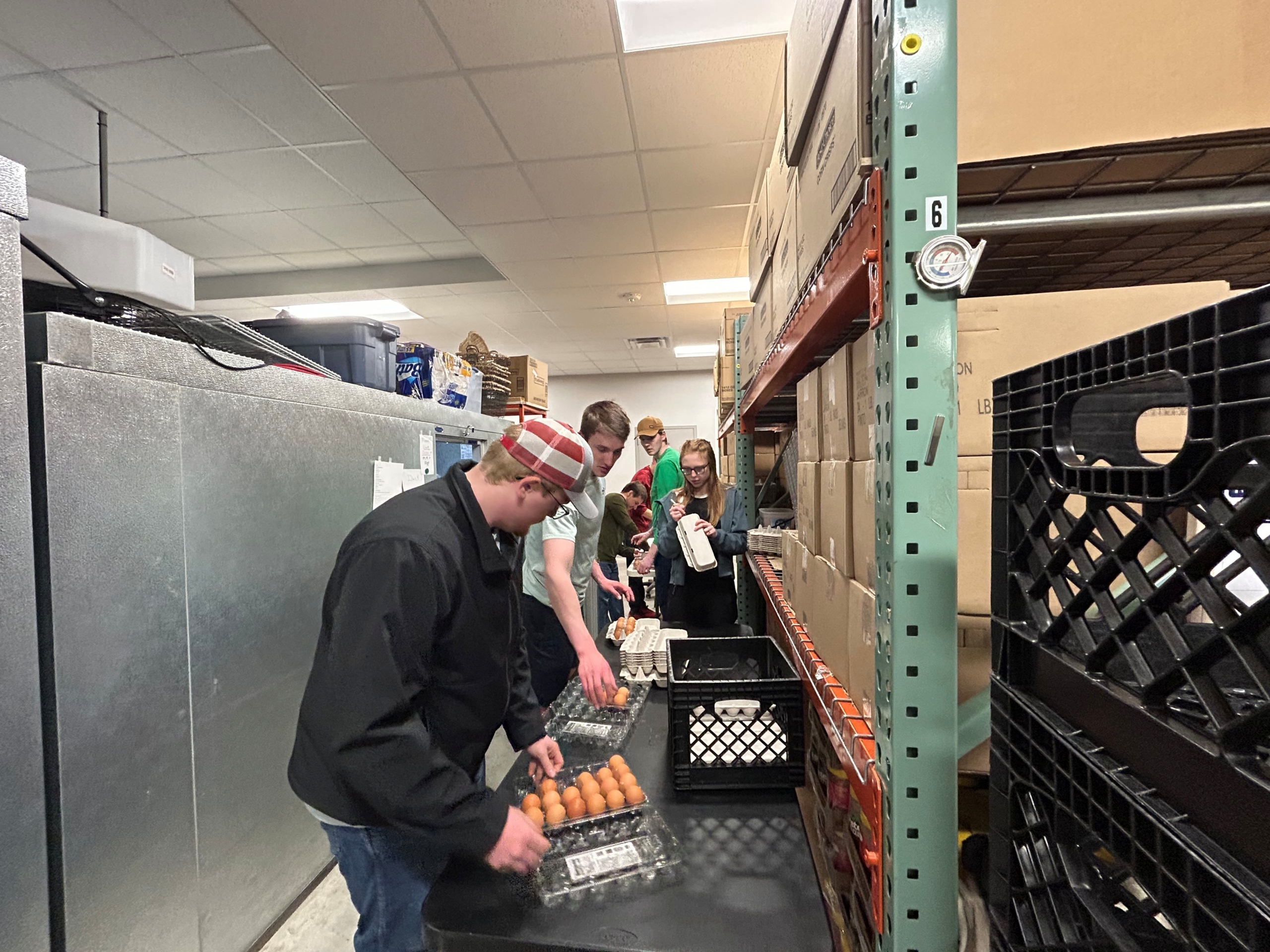 Young people sorting food at Community Pathways