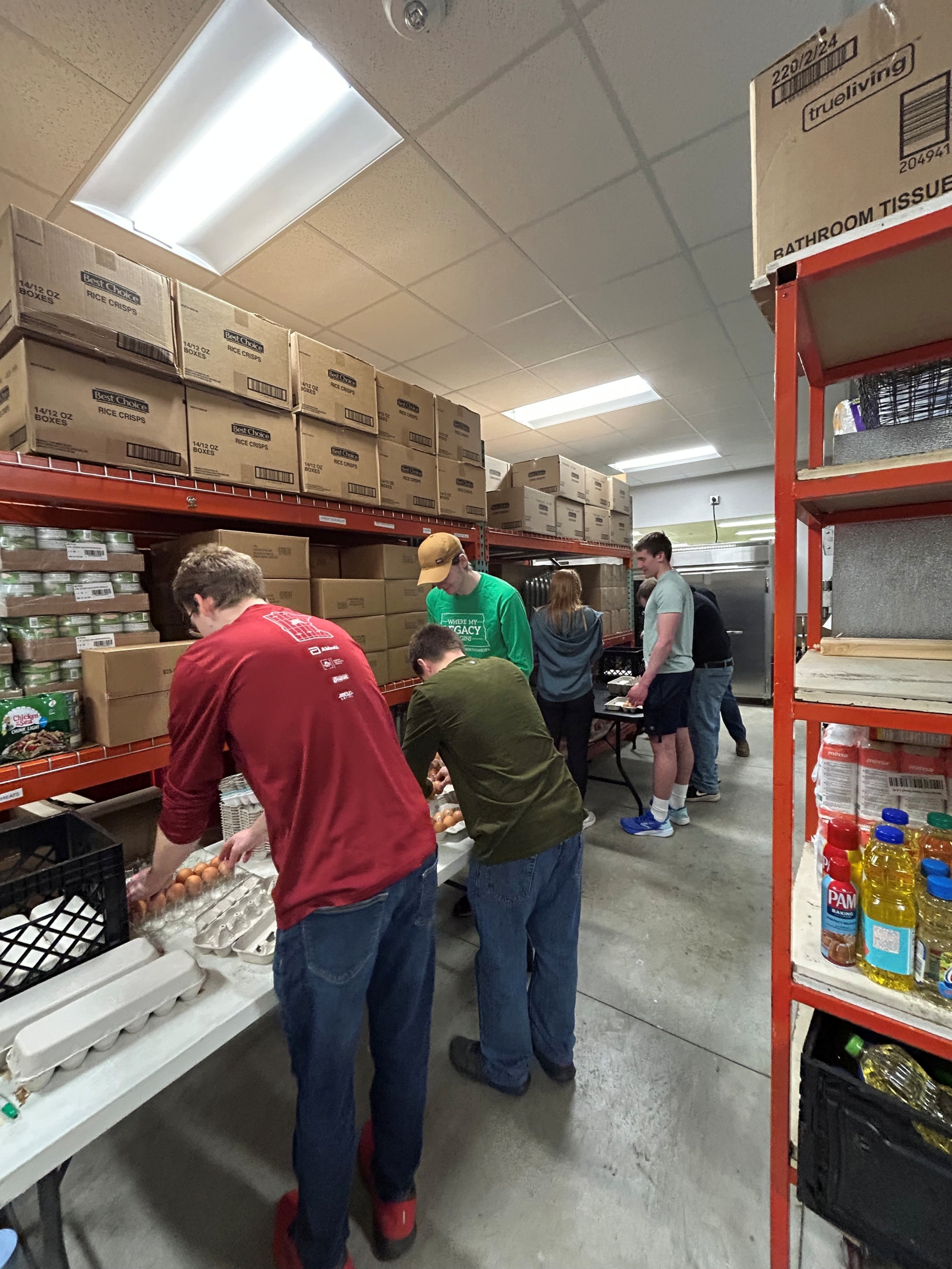 Young people sorting food at Community Pathways