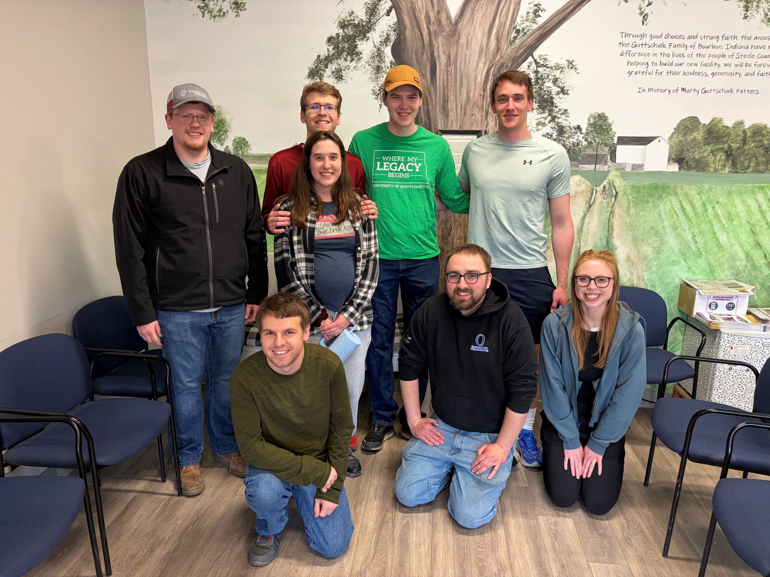 A group of young adults smiling